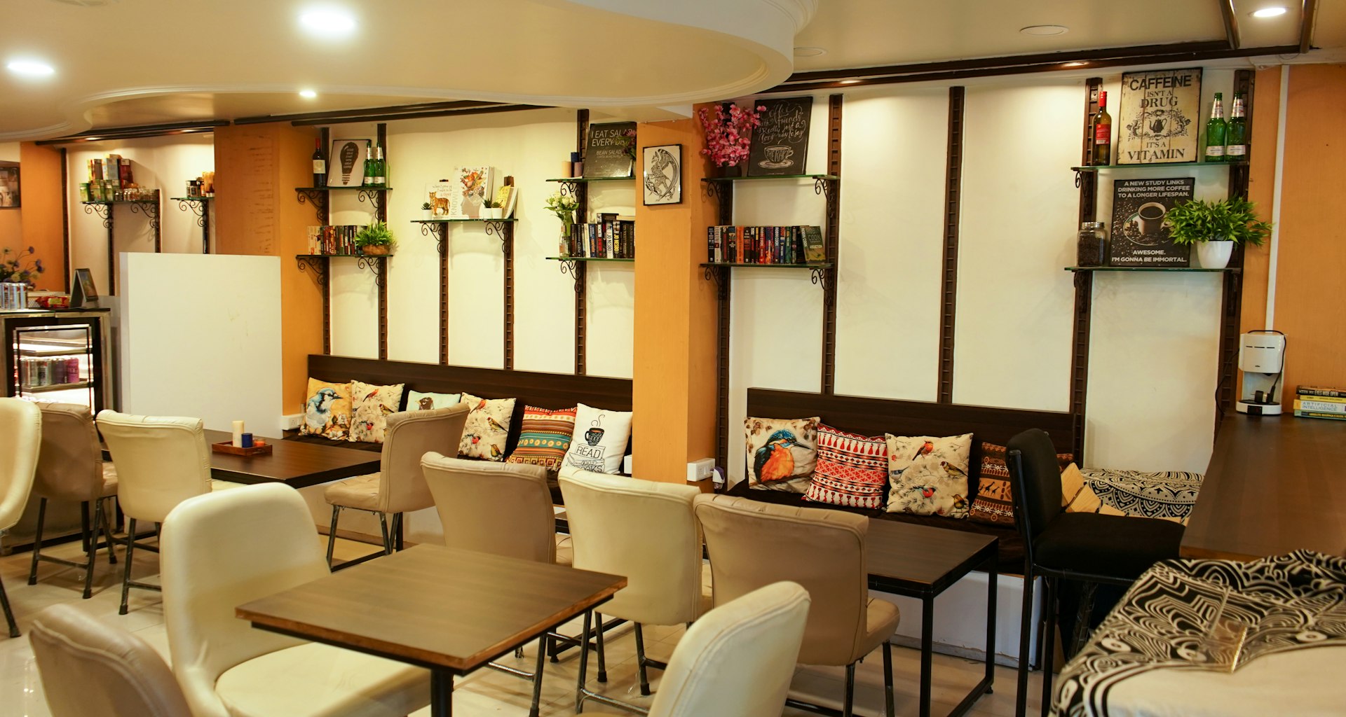 A restaurant with tables, chairs, and a bar